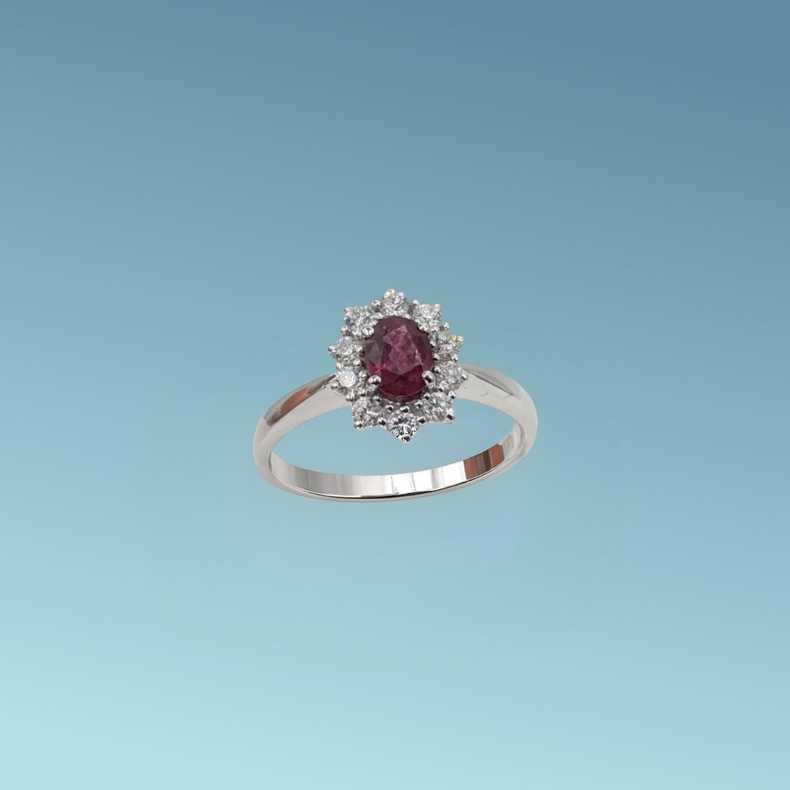 Anello oro bianco 18ct con Rubino da 0.60 carati e diamanti naturali di 0.34 carati realizzato da Meteore Gioielli