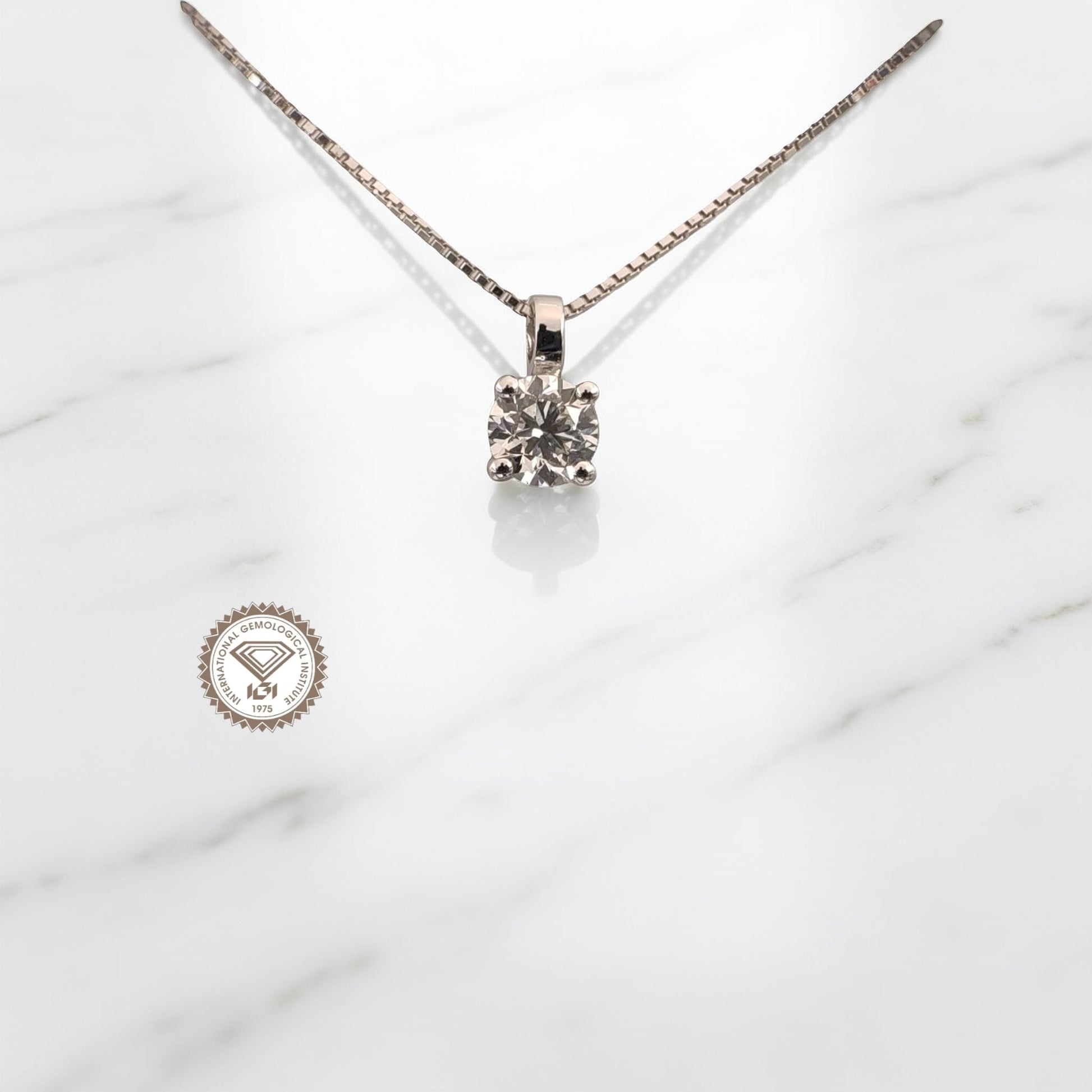 Punto luce in oro bianco 18kt di Meteore Gioielli con diamante naturale taglio brillante da 0.50 ct F/VS1 con certificato internazionale IGI N. 750545435