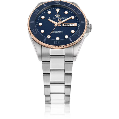 Orologio da uomo con movimento automatico Sellita SW220 e funzione di solo tempo con data.
Cassa in acciaio inox dal diametro di 42 mm. Lunetta placcata oro rosa con inserto in ceramica blu. Valvola a elio per garantire maggiore impermeabilità