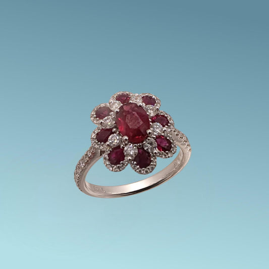 Anello oro bianco 18ct a forma di fiore con Rubini e diamanti naturali di Meteore Gioielli.