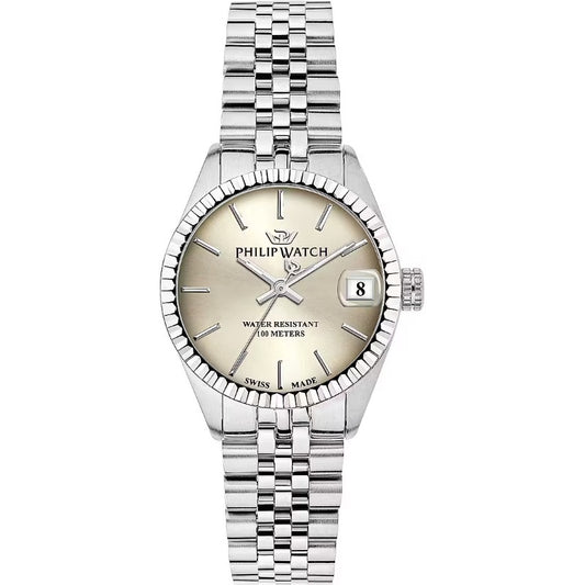 Orologio da donna swiss made con movimento al quarzo e funzioni di solo tempo con data.
Cassa rotonda realizzata in acciaio inox dal diametro di 31 mm; ghiera zigrinata.
Quadrante avorio con indici a bastoni color argento e datario alle ore 3. Logo PW nella parte alta. Vetro minerale e fondello in acciaio.