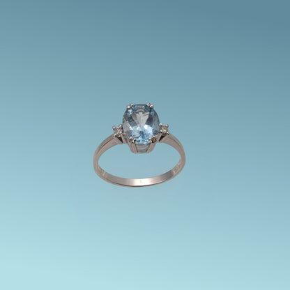 Anello in oro bianco 18kt di Meteore Gioielli con Acquamarina naturale taglio ovale ct 1.60 incassata su cestello con 4 griffes e due diamanti naturali ct 0.04
