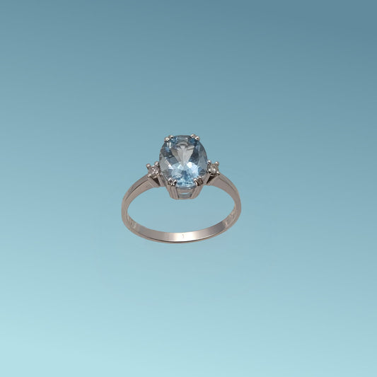 Anello in oro bianco 18kt di Meteore Gioielli con Acquamarina naturale taglio ovale ct 1.60 incassata su cestello con 4 griffes e due diamanti naturali ct 0.04