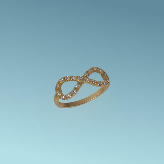 Anello in oro giallo 18kt di Meteore Gioielli con al centro il segno dell'infinito incassato con diamanti naturali taglio brillante ct 0.20 G/VS