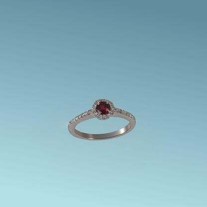 Questo anello in oro bianco 18kt di Meteore Gioielli combina la tonalità rossa del rubino ct 0.26 con i diamanti  ct 0.23 G/VS incassati intorno e sul gambo