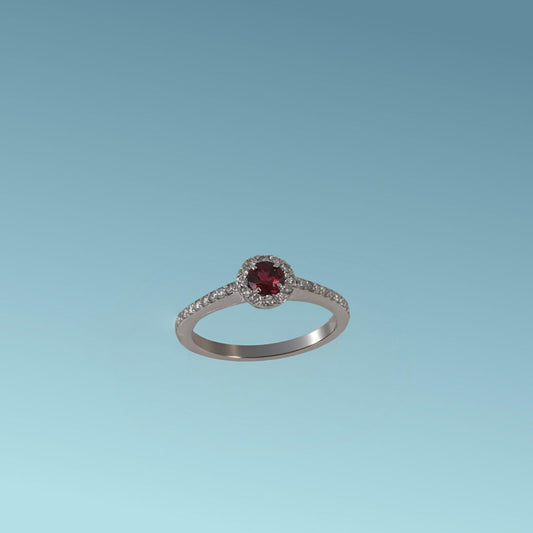 Questo anello in oro bianco 18kt di Meteore Gioielli combina la tonalità rossa del rubino ct 0.26 con i diamanti  ct 0.23 G/VS incassati intorno e sul gambo