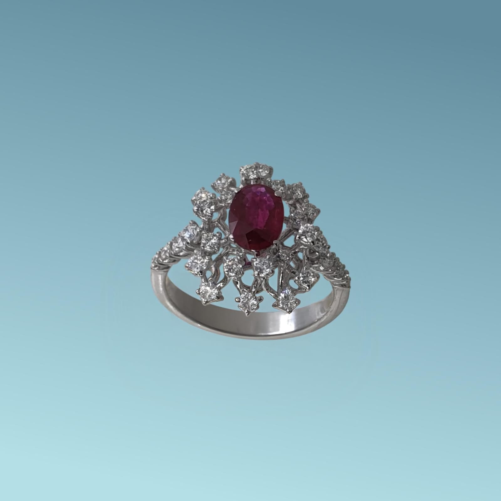 Questo anello di Meteore Gioielli rappresenta una splendida armonia tra il colore intenso del rubino naturale ct 0.71 posto al centro e la luminosità STELLARE dei diamanti naturali taglio brillante ct 0.61 G/VS.