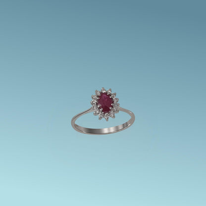 Anello con rubino di Meteore Gioielli rappresenta una splendida armonia tra il colore intenso del rubino naturale taglio ovale ct 0.54 e la luminosità impeccabile dei diamanti naturali taglio brillante ct 0.15 G/VS.