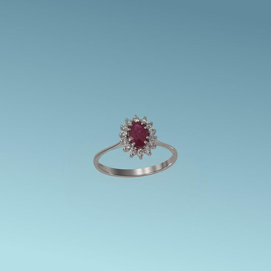 Anello con rubino di Meteore Gioielli rappresenta una splendida armonia tra il colore intenso del rubino naturale taglio ovale ct 0.54 e la luminosità impeccabile dei diamanti naturali taglio brillante ct 0.15 G/VS.