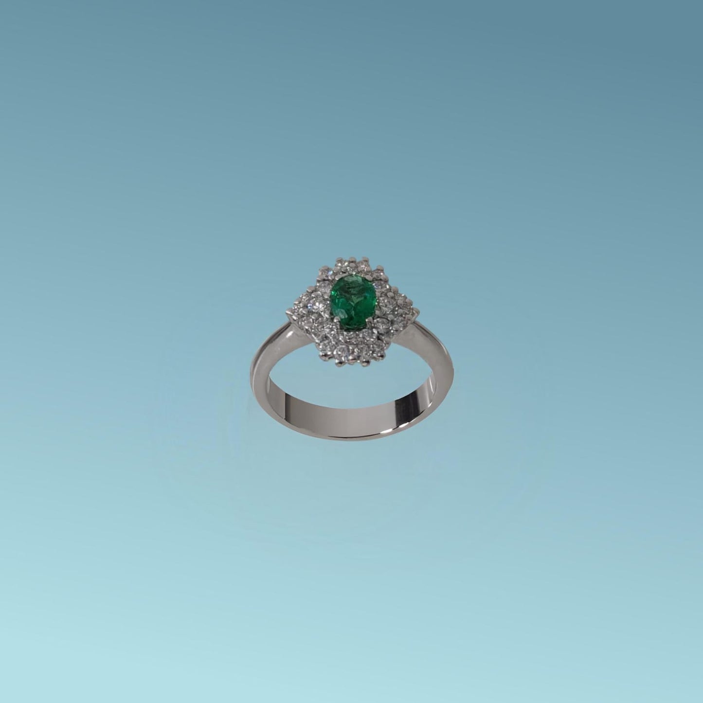 anello in oro bianco 18kt di meteore gioielli è un capolavoro di maestria orafa, lo smeraldo naturale ovale ct 0.45 posto al centro è esaltato dallo scintillio dei diamanti naturali taglio brillante ct 0.55