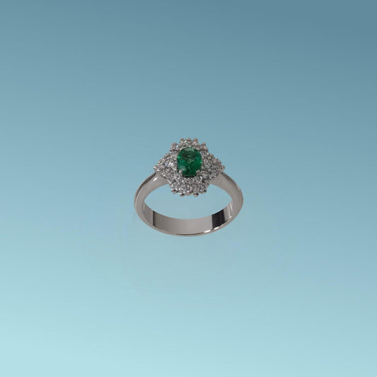 Anello in oro bianco 18kt di Meteore Gioielli è un capolavoro di maestria orafa, lo Smeraldo naturale ovale ct 0.45 posto al centro è esaltato dallo scintillio dei diamanti naturali taglio brillante ct 0.55