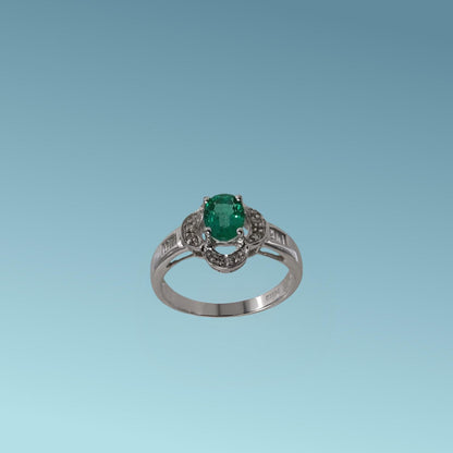Anello in oro bianco di Meteore Gioielli con smeraldo naturale circondato da petali in cui sono incassati diamanti naturali sul gambo diamanti taglio carré  0.18 ct