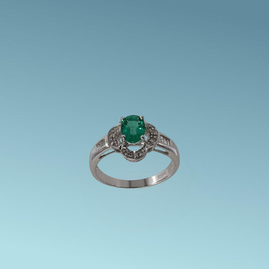 Anello in oro bianco di Meteore Gioielli con smeraldo naturale circondato da petali in cui sono incassati diamanti naturali sul gambo diamanti taglio carré  0.18 ct