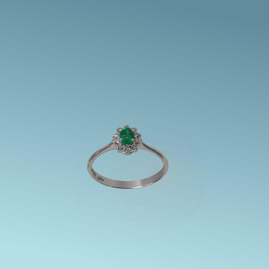 anello smeraldo ovale con giro di diamanti di meteore gioielli