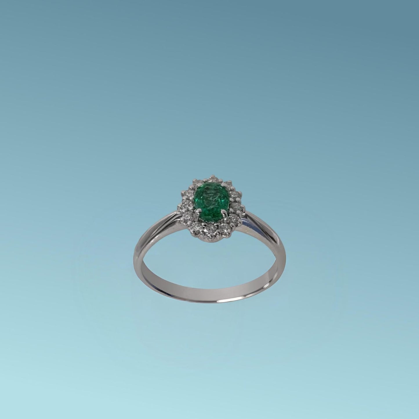 anello smeraldo ovale con giro di diamanti di meteore gioielli
