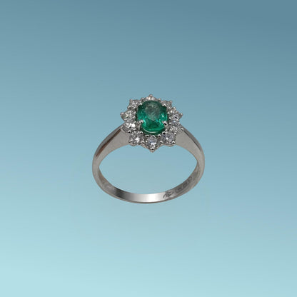 Anello oro bianco 18ct con Smeraldo di 0.72 carati e contorno di diamanti naturali di 0.52 carati realizzato da Meteore Gioielli 
