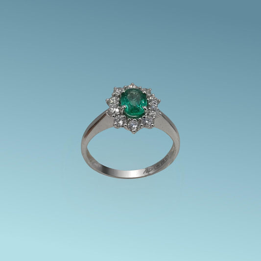 Anello oro bianco 18ct con Smeraldo di 0.72 carati e contorno di diamanti naturali di 0.52 carati realizzato da Meteore Gioielli 