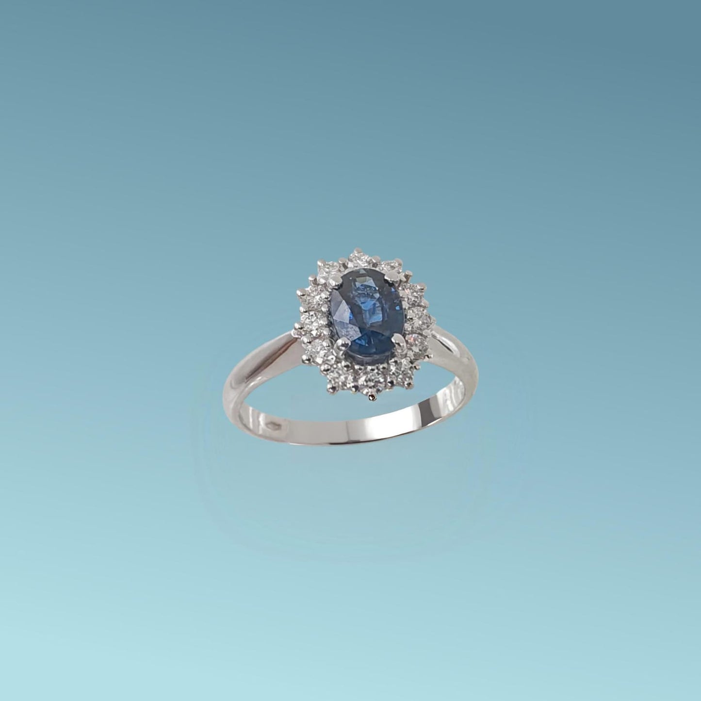 anello in oro bianco 18kt di meteore gioielli con zaffiro naturale ct 1.08 e contorno di diamanti naturali taglio brillante ct 0.27 g/vs