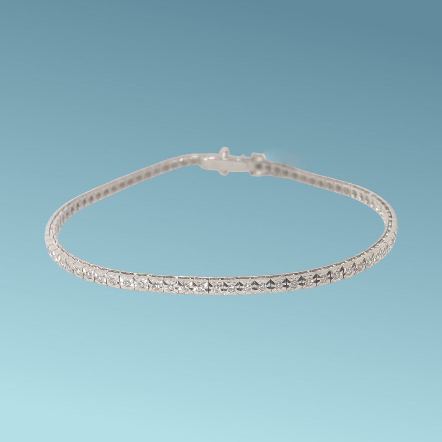 bracciale tennis in oro bianco 18kt di meteore gioielli con diamanti naturali taglio brillante ct 0.42 g/vs incassati su montatura con castoni a piramide su base quadra 