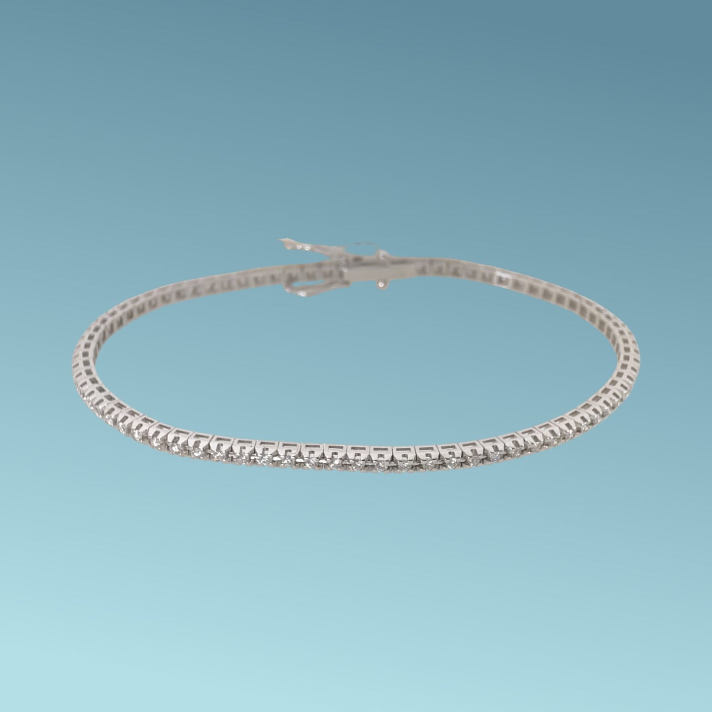 bracciale tennis in oro 18kt di meteore gioielli con diamanti taglio brillante incassati su una montatura con castoni a piramide