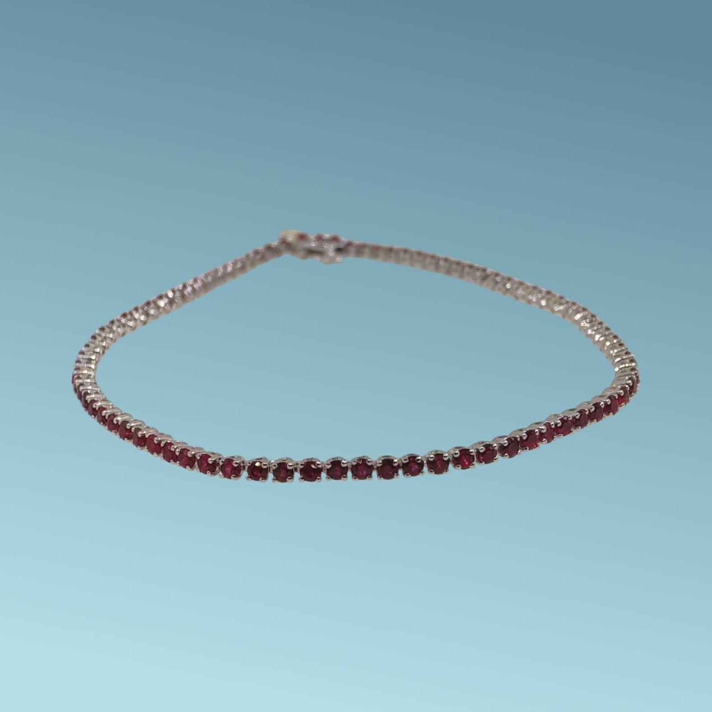 bracciale tennis in oro bianco 18kt&nbsp; da cm 18 di meteore gioielli con rubini naturali taglio brillante per un totale di 2.38 ct 