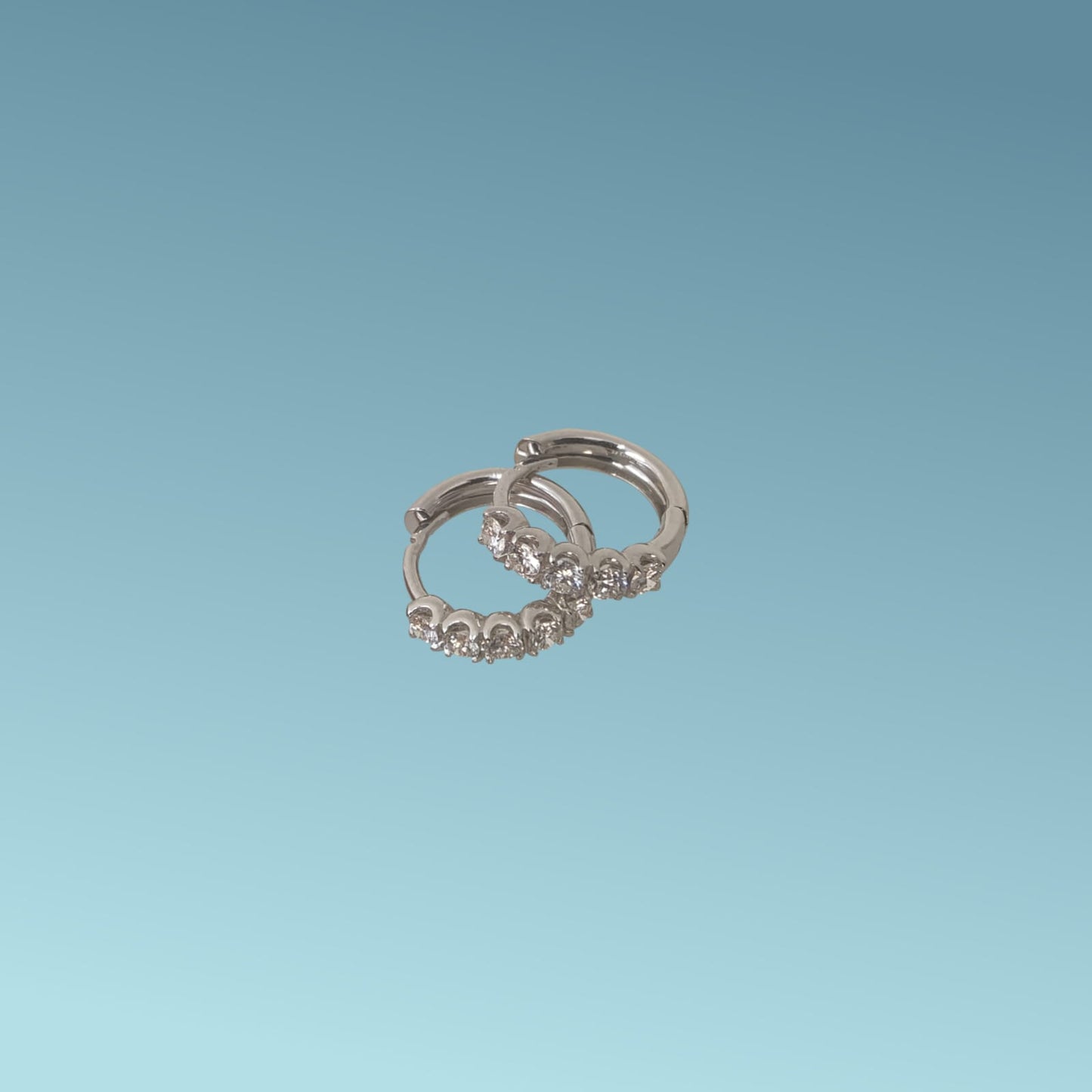 cerchi in oro bianco 18kt di mirco visconti con  5 diamanti naturali taglio brillante  0.63 kt g/vs.