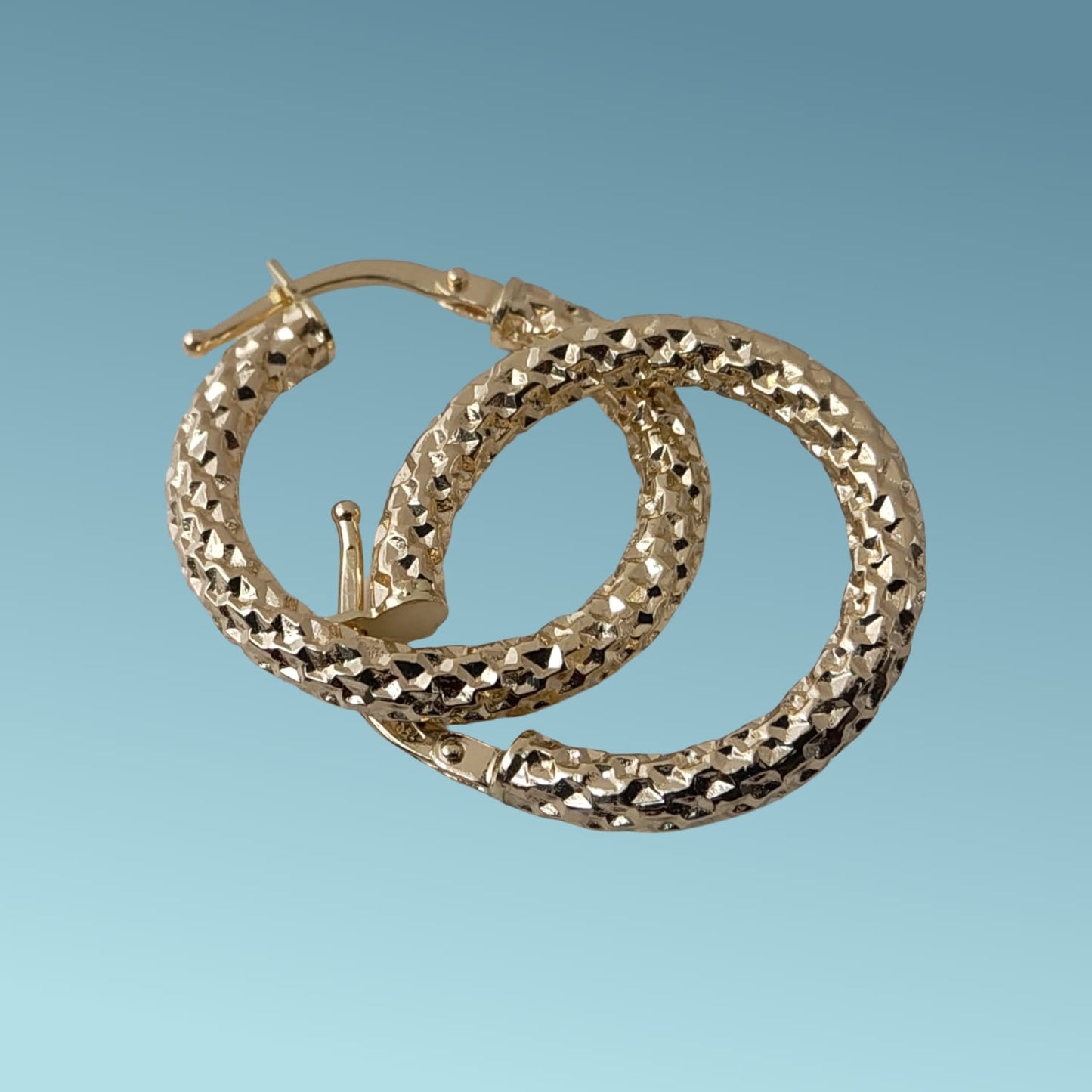 cerchi in oro giallo 18kt con lavorazione in rilievo diamantata