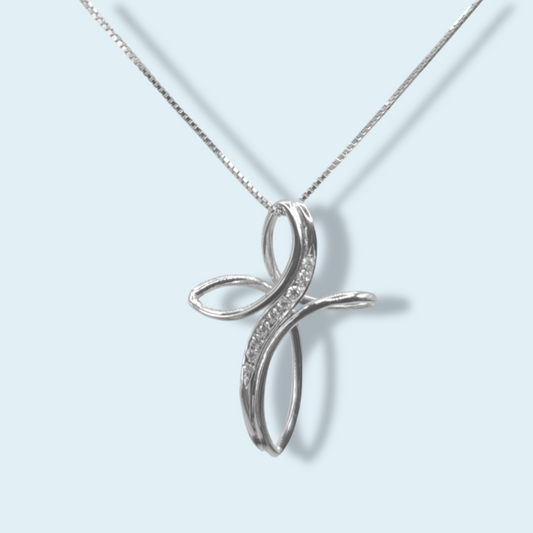 collana con croce di Meteore gioielli stile moderno, linee ondulate. Oro bianco 18 carati e diamanti.