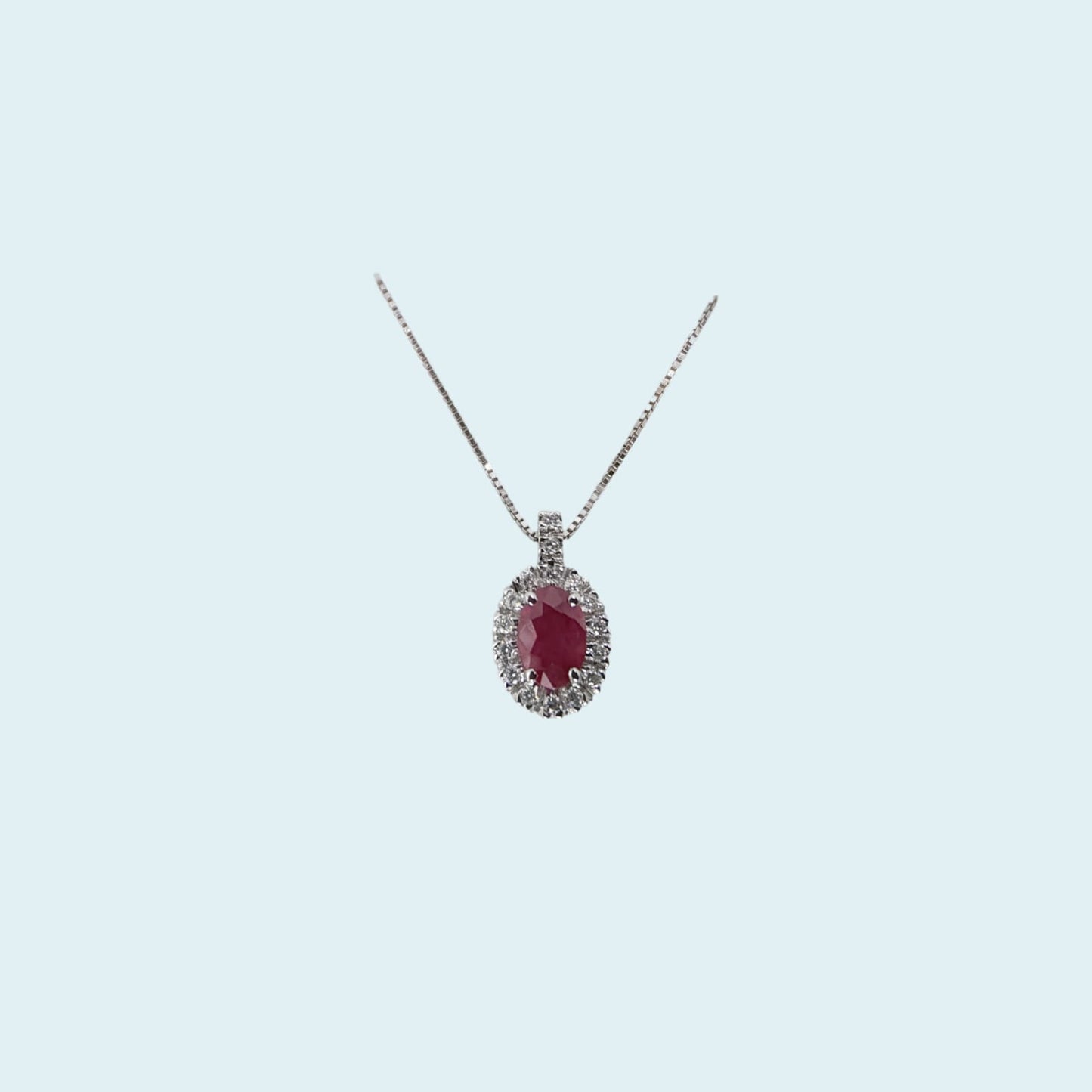 collana in oro bianco 18kt cm 45 di meteore gioielli con rubino naturale taglio ovale e contorno di diamanti naturali taglio brillante.