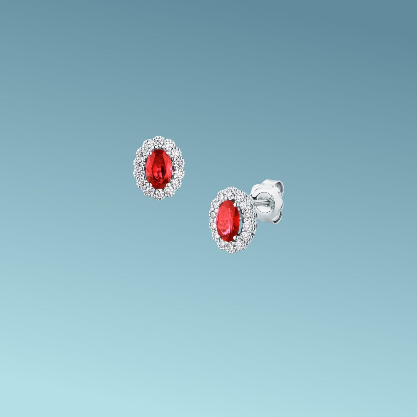 orecchini in oro bianco 18kt di mirco visconti con rubini naturali taglio ovale da 1.05 ct e un contorno di diamanti naturali taglio brillante ct 0.31 g/vs.