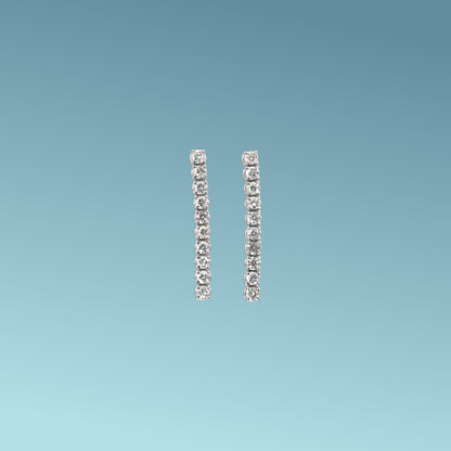 orecchini tennis morbidi  in oro bianco 18kt  di Meteore Gioielli presentano 10 diamanti naturali taglio brillante per ognuno per un totale di 0.37ct G/VS 